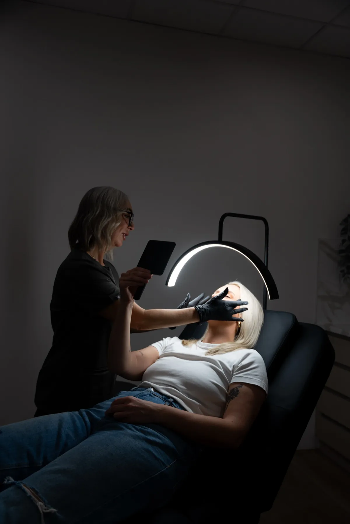 Tracy Dixon performing cosmetic treatment at NuVive Cosmetics